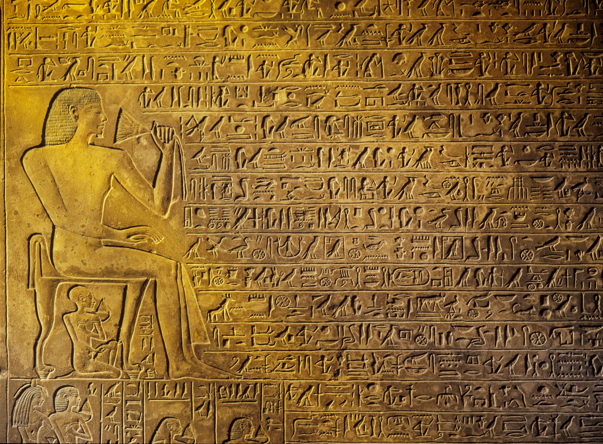 Ancient Egyptian hieroglyphs carved in stone